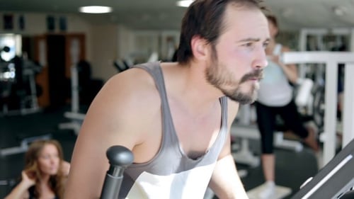 Man Using Elliptical Cross