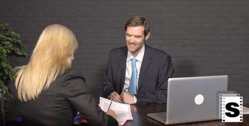 Business Meeting: Signing Paperwork and Handshake