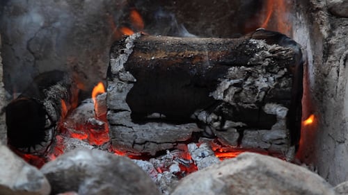 Glowing Fireplace Flames and Burning Logs