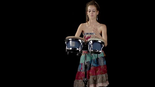 Woman Playing Bongos in Studio Setting