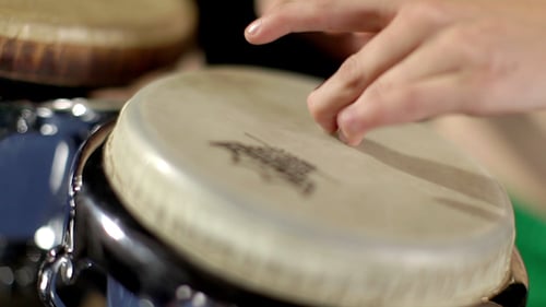 Female Percussion Drummer Performing With Bongos 4