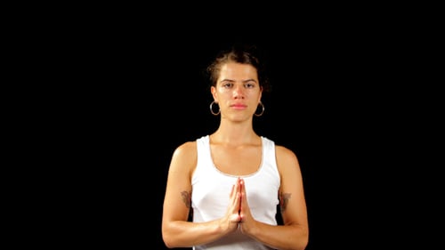 Young Adult Does Yoga Poses on Black Background