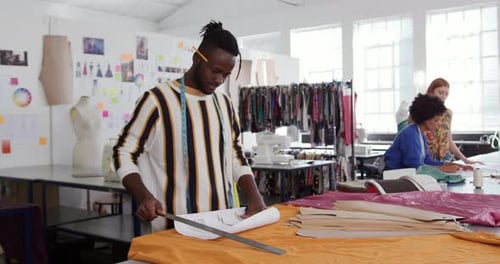 Mixed race man working in creative office