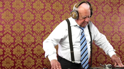 Senior Man DJing with Record Players