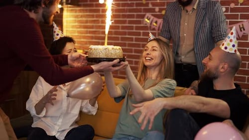 Happy Friends Celebrating a Birthday Party Indoors