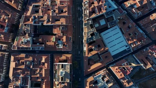 Aerial Birds Eye Overhead Top Down Panning Shot of Blocks of Buildings in Town