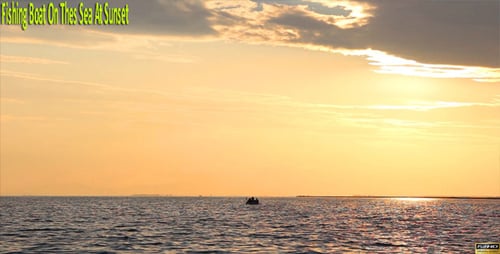 Fishing Boat On The Sea At Sunset