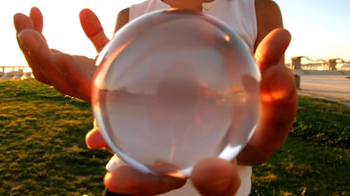 Abstract Shot of Glass Orb Reflecting Sunset