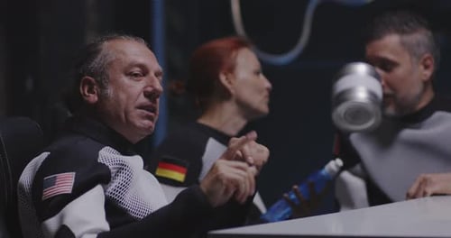 Adults in Futuristic Setting with Can