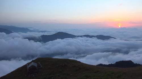 Sunset Above Clouds on Mountain
