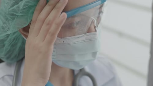 Health Professional Wearing Protective Gear in Hospital Setting