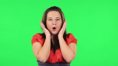 Portrait of Very Surprised Girl with Shocked Wow Face Expression. Green Screen