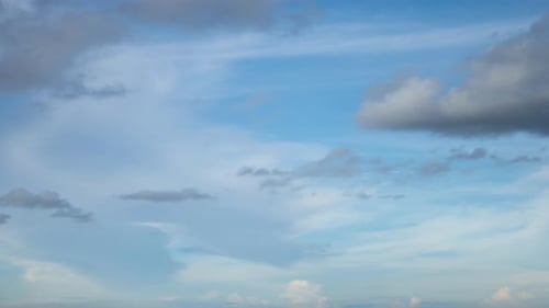 Clouds Moving Across a Blue Sky