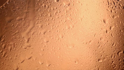 Gotas de agua salpicaduras sobre vidrio 301