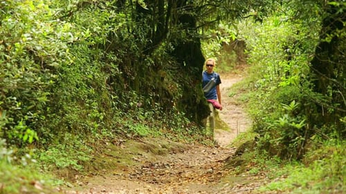 Female Tourist Walking Along Footpath 2