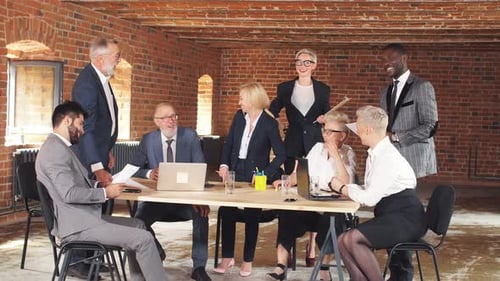 Diverse Business Team Meeting in Brick Office