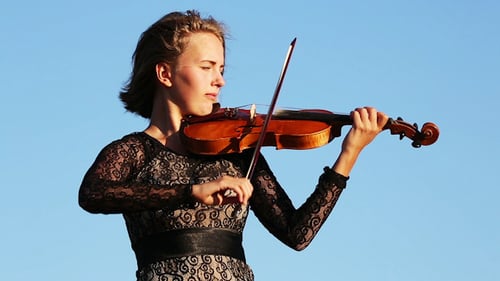 Woman Playing Violin with Blue Sky Background