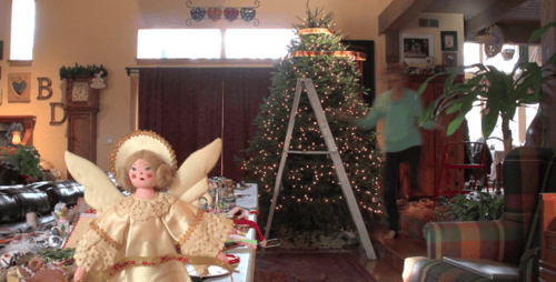 Family Decorating Christmas Tree Together at Home