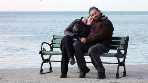 Lovers Hugging At Coast