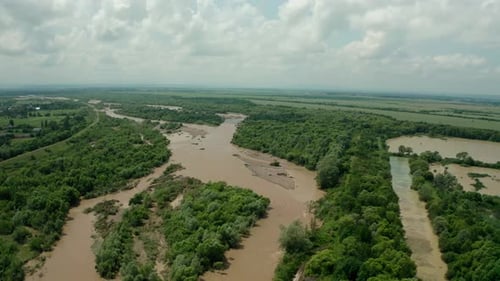 Aerial Drone View. Rriver Water Big and Dirty After Heavy Rain. Wide View V4