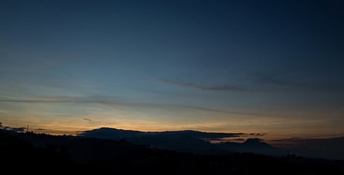 Scenic Time-Lapse of a Sunrise Over Hills