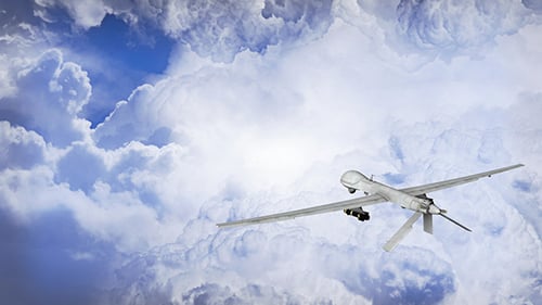 Drone UAV Flying Through Clouds with Missiles