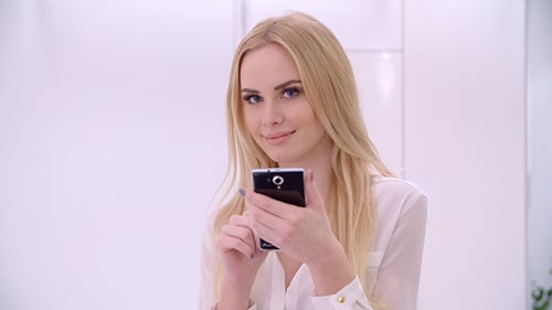 Young Blond Girl Using Mobile Phone