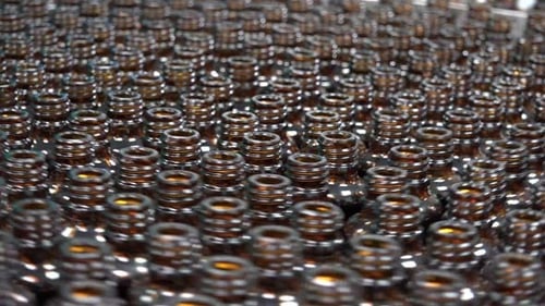 Medicine Bottles Moving on a Conveyor Belt