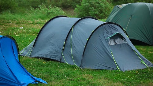 Camping Tents on Green Field