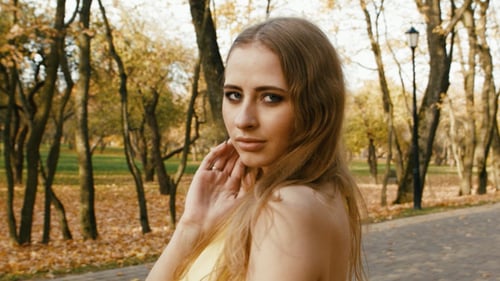 Beautiful Woman Posing in Autumn Park