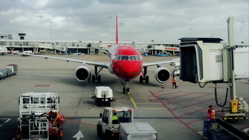Passenger Airplane Prepares for Flight at Airport Terminal