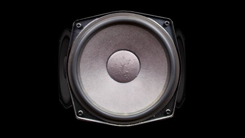 Gray Speakers Rotating on a Black Background