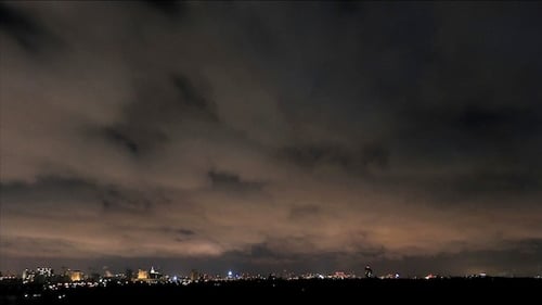 Night Sky And Clouds Over The City