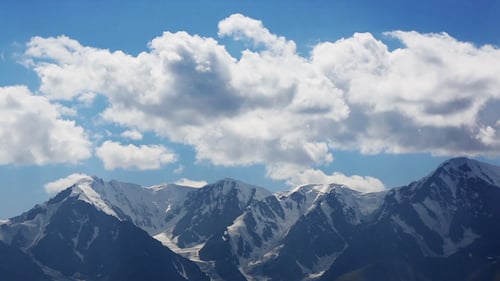 Scenic Mountains Under Blue Cloudy Sky