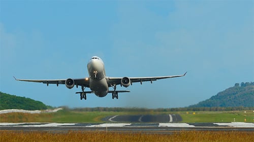 Commercial Airplane Taking Off From Airport Runway