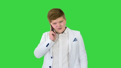 Businessman Boy Making a Call with Smartphone on a Green Screen Chroma Key