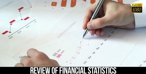 Hand Marking Financial Graph in the Workplace
