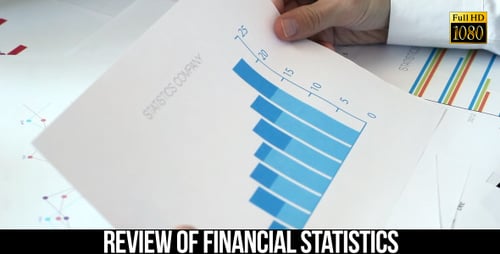 Hands Examine Colorful Business Statistics and Reports