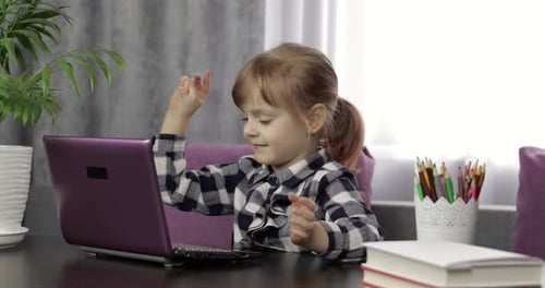 Happy Girl Celebrates at Laptop Computer