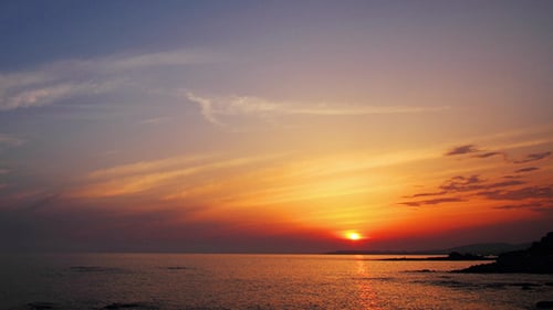 Sunset With Clouds Over Sea