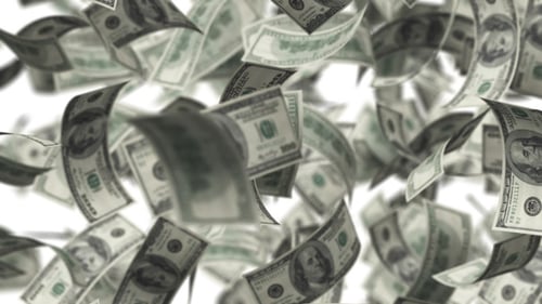 Hundred Dollar Bills Falling Against White Background