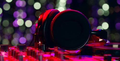 Close Up of DJ Mixer and Headphones with Lights