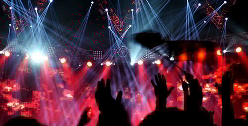 Concert Crowd Silhouettes Bathed in Stage Lighting