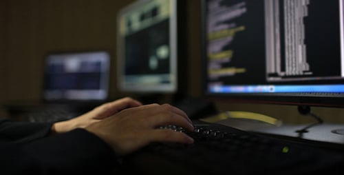 Hacker in Hood Typing on Keyboard 4