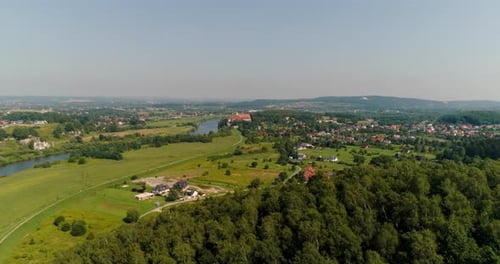 Aerial View of Landscape and Small City Agains Mountains