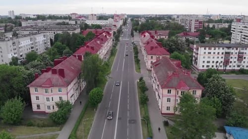Aerial View of a Busy City Road and Residential Buildings with Infrastructure on a Summer Day