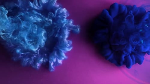 Abstract Background. Color Burst - Blue Colors Explosion Fluid Ink Slow Motion