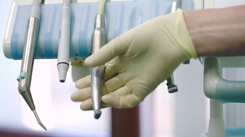 Dentist Putting Tool On Its Place After Using