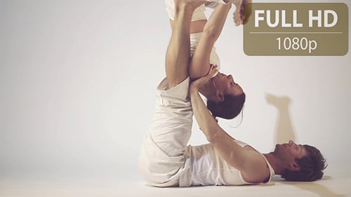 Couple Doing Yoga Exercises 1
