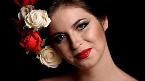 Woman with Flowers in Hair Posing